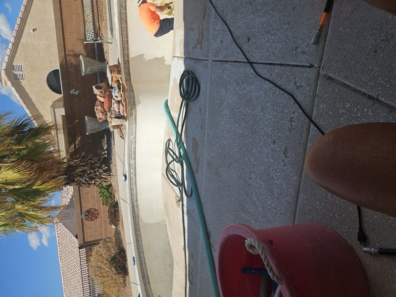 The Bullhead City pool drained, with the algae and calcium layer being scraped off the walls