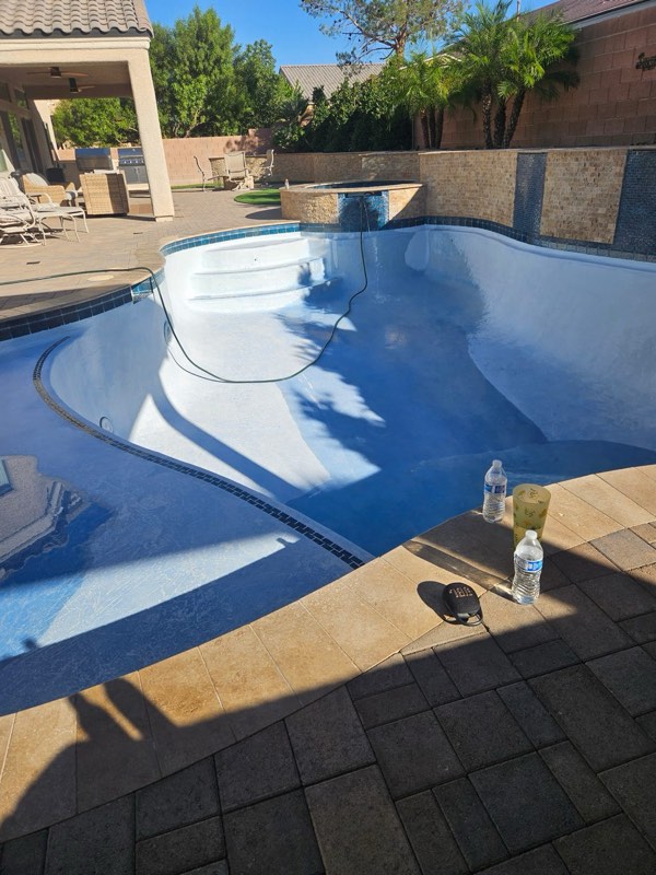 A pool refilling with fresh water after being drained and washed